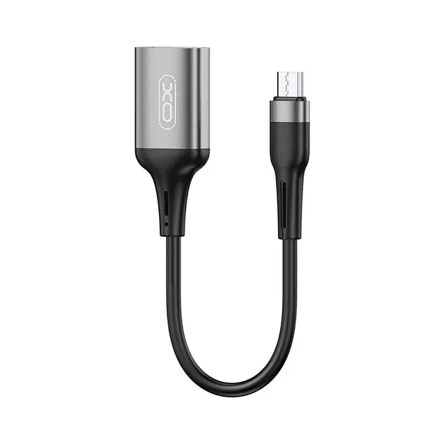 OTG Micro USB кабель, підключений до смартфона з флеш-накопичувачем, демонструючи можливість підключення зовнішніх пристроїв для обміну даними.